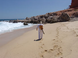Greg walking on the beach in Cabo
