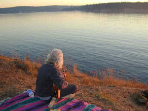 Playing a backpacker guitar on Lopez Island