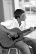Josh Wellington playing his guitar