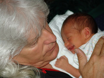 Holding baby Kayden and telling him I would take care of him